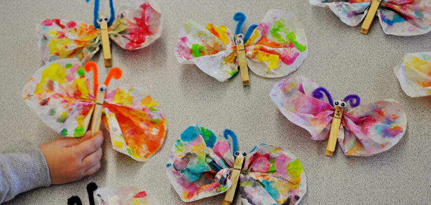 Funny and easy butterflies made from coffee filters, clothespins and chenille stems.