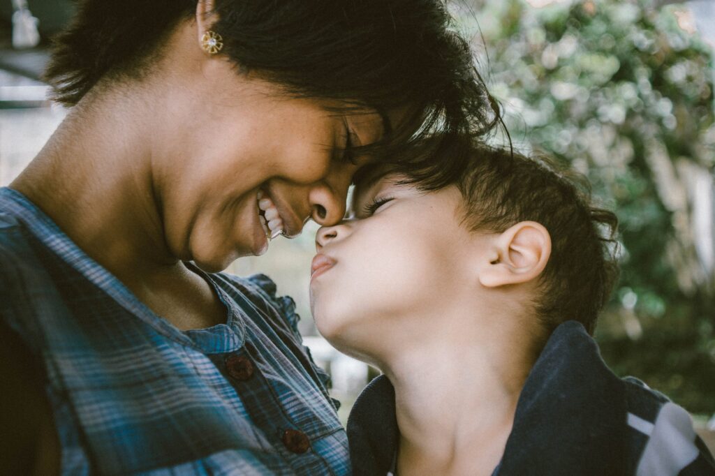 adult smiling with child