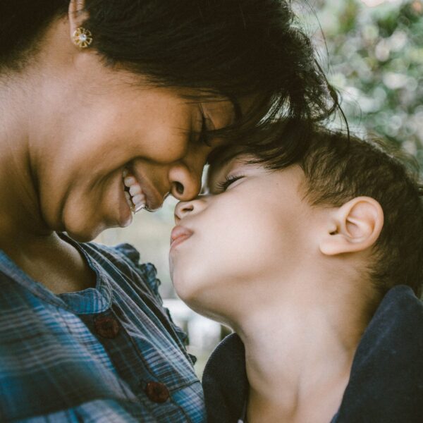 adult smiling with child