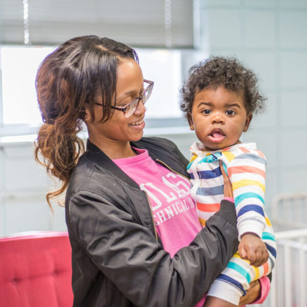 woman holding a child
