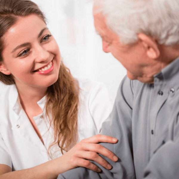 smiling caregiver with elderly man